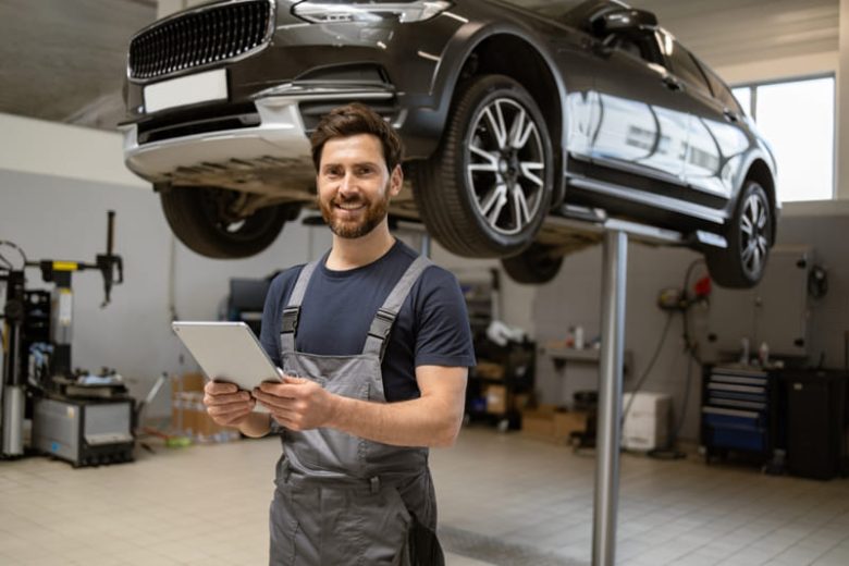Happy mechanic in garage