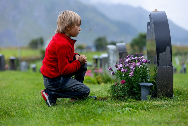 Young boy at graveside