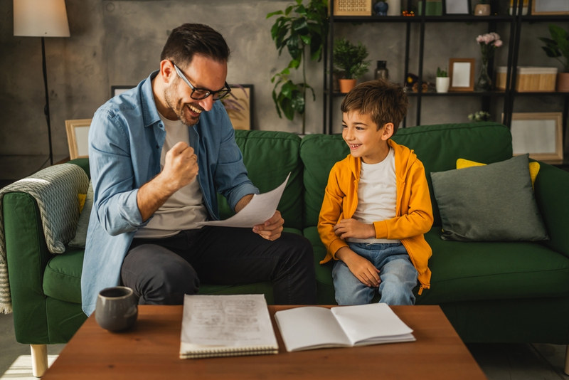 Dad and son celebrating effort