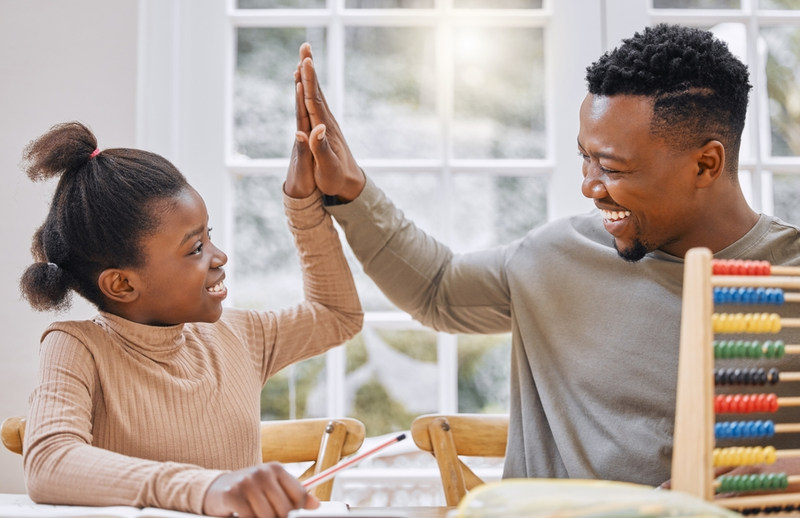 Dad daughter high five