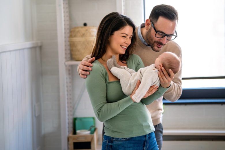 Adoptive parents with new baby