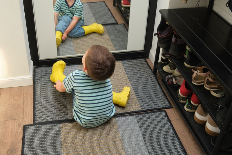 Child Putting Shoes On