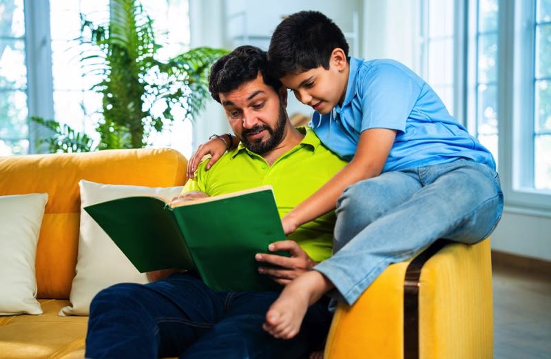 Single dad reading to child