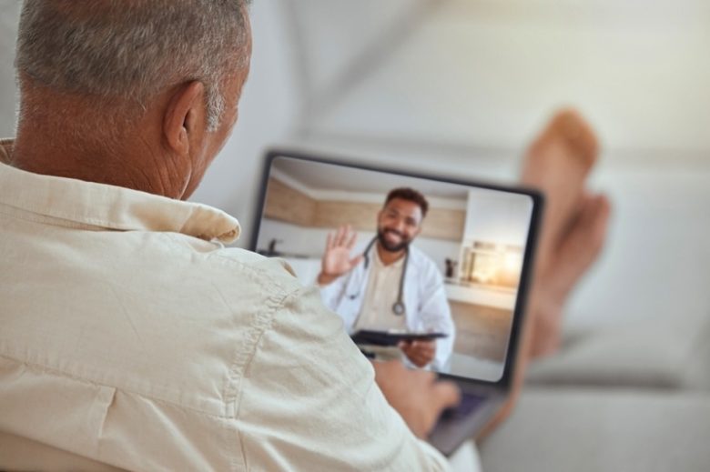 Man checking in with his doctor online