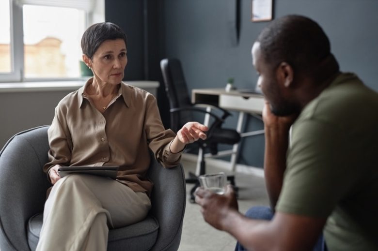 Man chatting with his therapist