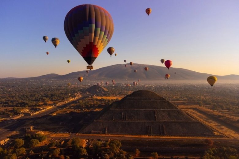 Hot air balloons over Teotihuacan pyramid