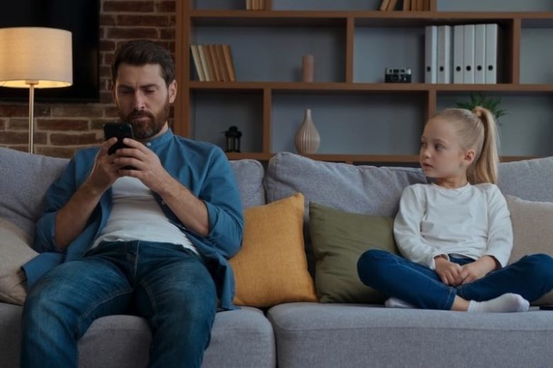 Dad and daughter on sofa