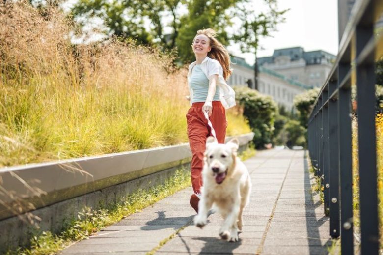 Teenager walking family dog on her own